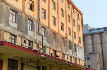 Fototapeta na wymiar Abandoned rundown industrial factory buildings