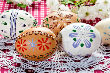 Obraz na płótnie Canvas Painted Easter eggs on the white tablecloth