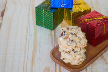 Nut cookies  on wooden tray.,Chocolate cookies on wooden table.,