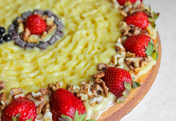 Cake with strawberries and nuts. Tart and cream