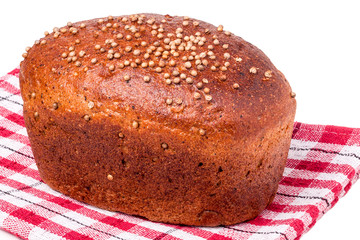 Black bread with fresh coriander seeds closeup