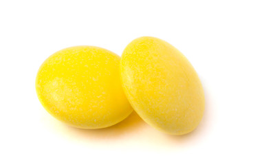 Two yellow tablets on a white background