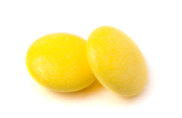 Two yellow tablets on a white background