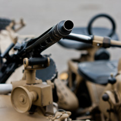 Machine gun mounted on a motorcycle.