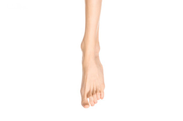 Pedicure and foot care topic: the naked man's legs isolated on white background in studio