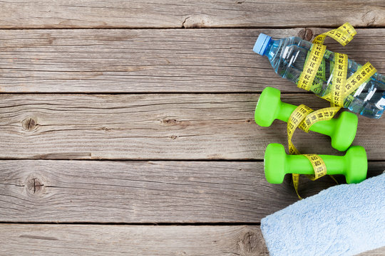 Dumbbells, water and tape measure