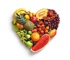 Heart symbol. Fruits diet concept. Food photography of heart made from different fruits isolated...