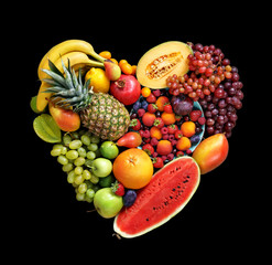 Deluxe Heart symbol. Fruits diet concept. Food photography of heart made from different fruits on black background. High resolution product.