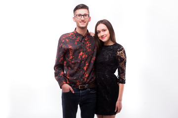 Hipster couple. Beautiful young loving couple posing while standing against white background.