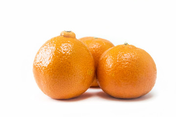 Three tangerines isolated closeup