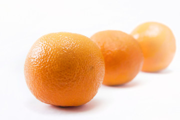 Three tangerines isolated closeup