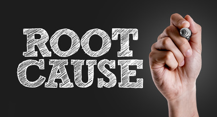 Hand writing the text: Root Cause