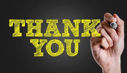 Hand writing the text: Thank You