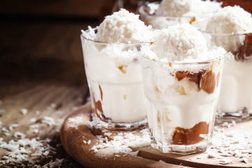 Coconut dessert with vanilla ice cream and caramel, selective fo