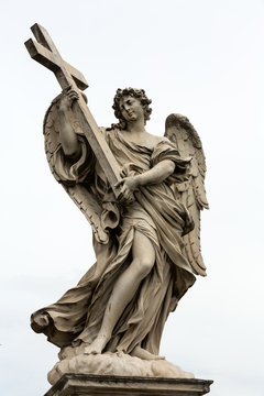 Marble statue of Angel with the Cross by Ercole Ferrata  from the Sant'Angelo Bridge in Rome, Italy