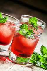 Cranberry cocktail Cape Codder with vodka and ice, selective foc