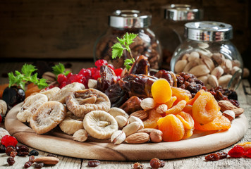 Mix dried fruits and nuts, healthy diet, eating lean, old wooden