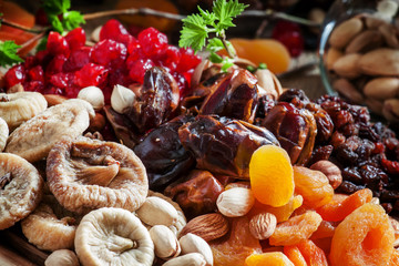 Mix dried fruits and nuts, healthy diet, eating lean, old wooden