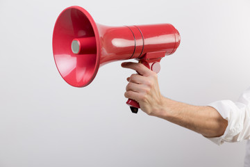 Business man holding a red loudspeaker - 106055109