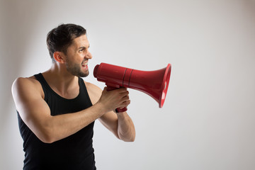 Male dancer shouts in a loudspeaker