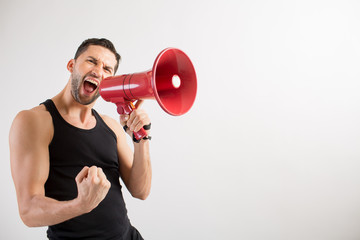 Male dancer shouts in a loudspeaker - 106055163