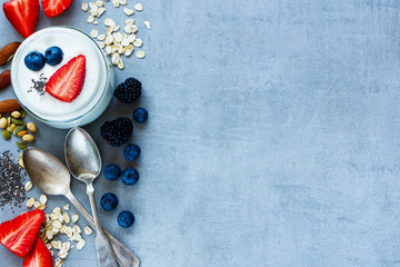 Fototapeta na wymiar Oat flakes, berries with yogurt