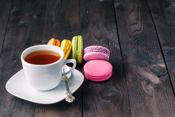 Cup of coffee and french macaron