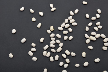 White beans on black background. Food vegan, vegetarian. Healthy
