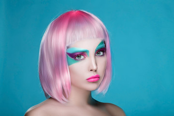 Mad Portrait of Girl with Hands with face art and pink wig. Ideal for advertisement
