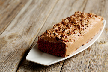 Chocolate cake on a grey wooden background