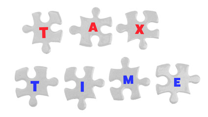Tax Concept. White jigsaw puzzle with pieces isolated on white