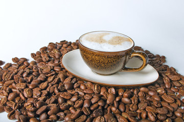 Close up coffee cup and beans on a white background