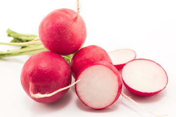 Radishes close-up isolated on white.
