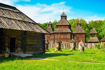 Fototapeta na wymiar Old wooden house near old wooden church