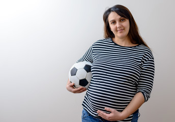 Pregant woman with soccer ball