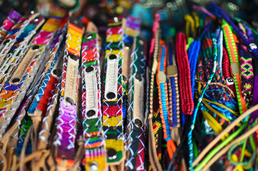 Fototapeta premium Numerous wristbands with Guatemala sing at the craft market 