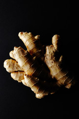 Ginger root. On black background.