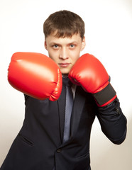 Businessman in red boxing gloves