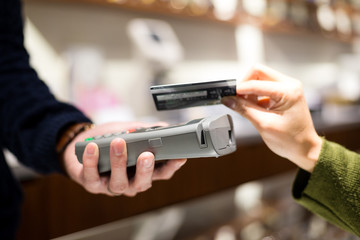 Customer paying credit card with NFC technology