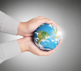  hand holding globe Elements of this image furnished by NASA