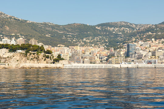 Color DSLR stock image of luxury apartment building and condominiums in Monte Carlo, Monaco, on the French Riviera. Horizontal with copy space for text