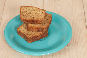 Homemade banana bread sliced on a table . rustic style