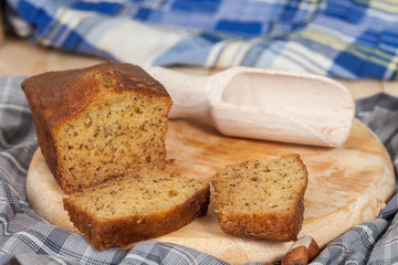 Homemade banana bread sliced on a table . rustic style