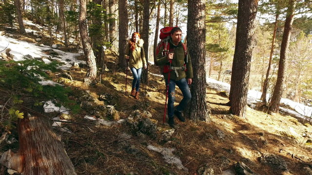 Couple  hiking outdoors at romantic place in mountain