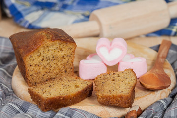 Homemade banana bread sliced on a table . rustic style