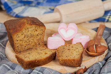 Homemade banana bread sliced on a table . rustic style