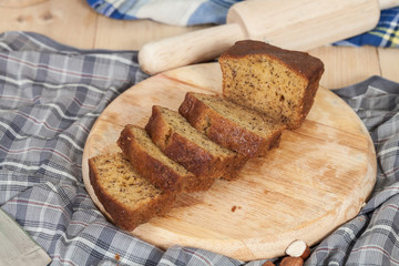 Homemade banana bread sliced on a table . rustic style