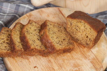 Homemade banana bread sliced on a table . rustic style