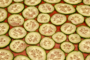 background from sliced thin slices of cucumber