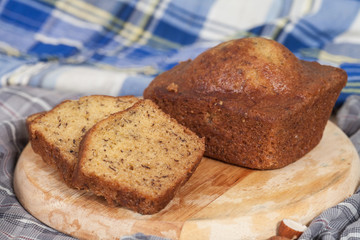Homemade banana bread sliced on a table . rustic style